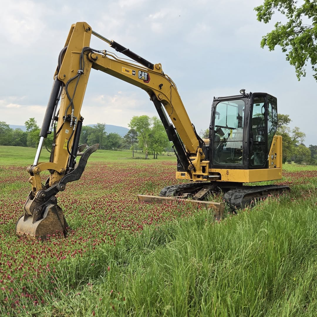 Nebo Earthworks CAT excavator in a Central Arkansas field